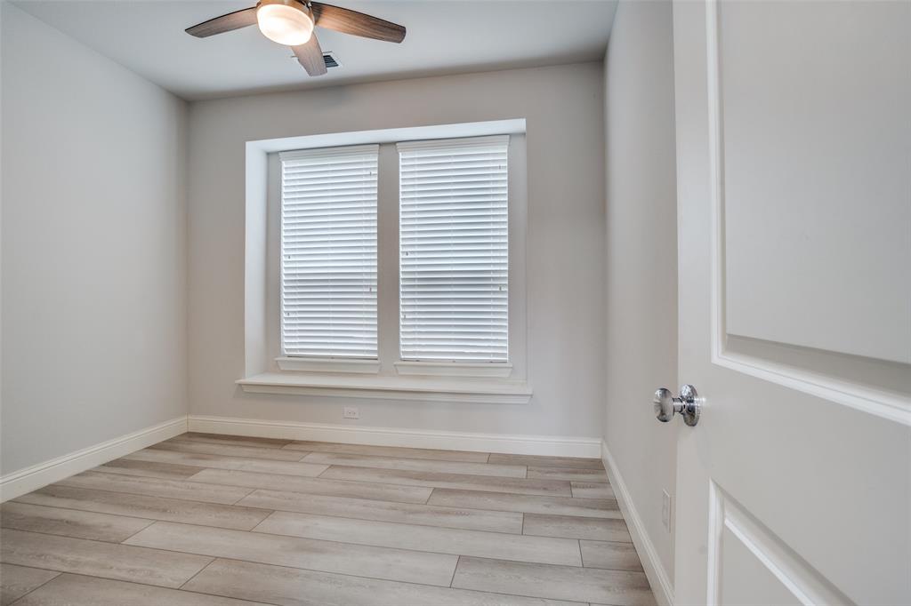 2811 Killdeer Trail Prosper, TX 75078 - Photo 16 of 36 Unfurnished room with light wood-style flooring and a ceiling fan