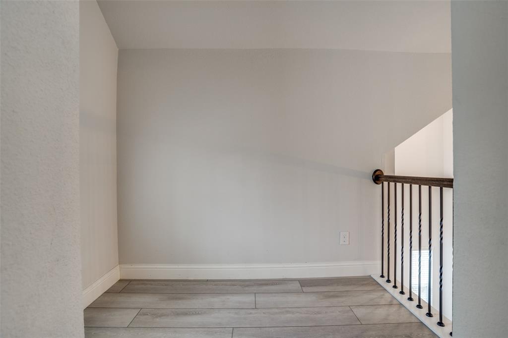 2811 Killdeer Trail Prosper, TX 75078 - Photo 23 of 36 Unfurnished room featuring light wood-type flooring and baseboards