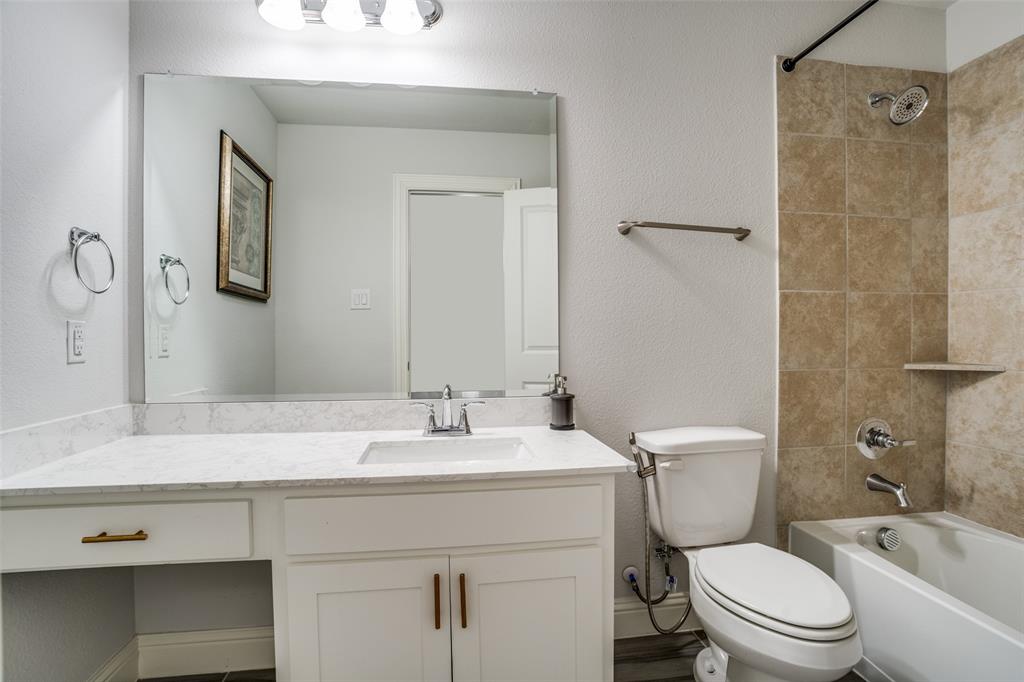 2811 Killdeer Trail Prosper, TX 75078 - Photo 28 of 36 Bathroom with shower / bathtub combination, vanity, and a textured wall