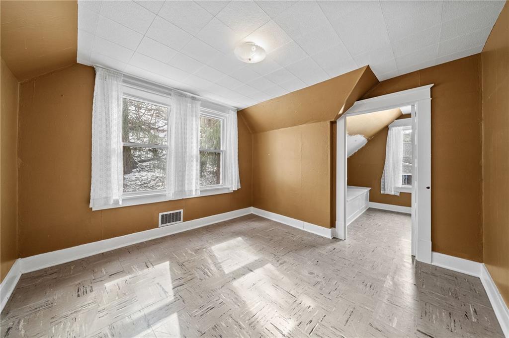 1341 Scrubgrass Road Carnegie, PA 15106 - Photo 13 of 21 a view of an empty room with a window
