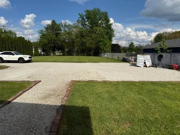 a view of outdoor space with deck and yard