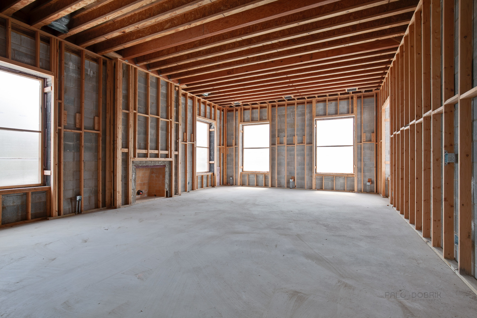333 Foster Place Lake Forest, IL 60045 - Photo 9 of 21 a view of an empty room with a fireplace and windows