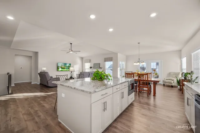a large kitchen with lots of counter space and stainless steel appliances