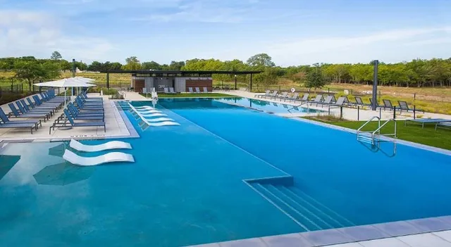 a view of swimming pool from a balcony