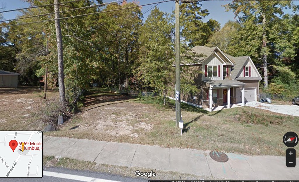 6969 Mobley Road Columbus, GA 31904 - Photo 4 of 15 a front view of a house with a yard