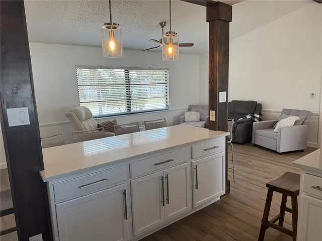 a spacious bathroom with double vanity and a mirror