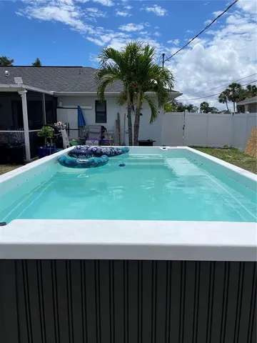 a couple of table and chairs in patio yard