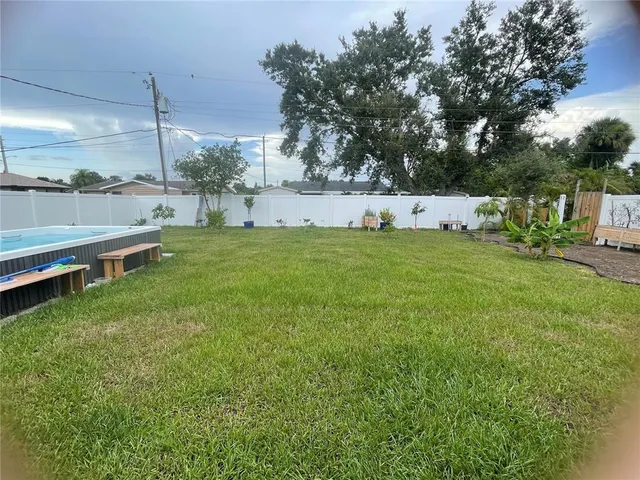a backyard of a house with lots of green space