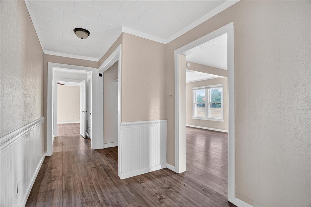 320 North 2nd Street Jacksboro, TX 76458 - Photo 7 of 16 a view of hallway with wooden floor