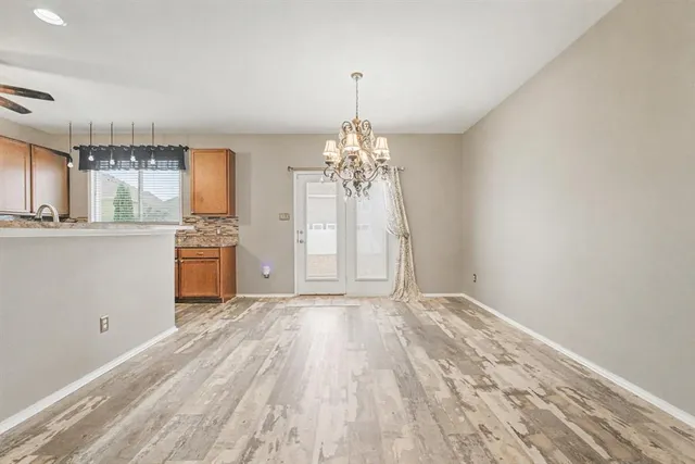 a view of a kitchen with a dishwasher cabinets and a wooden floor