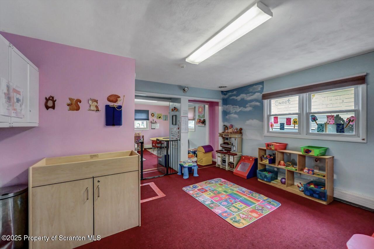 2118 Washburn Street Scranton, PA 18504 - Photo 23 of 72 a room with furniture and a dining table