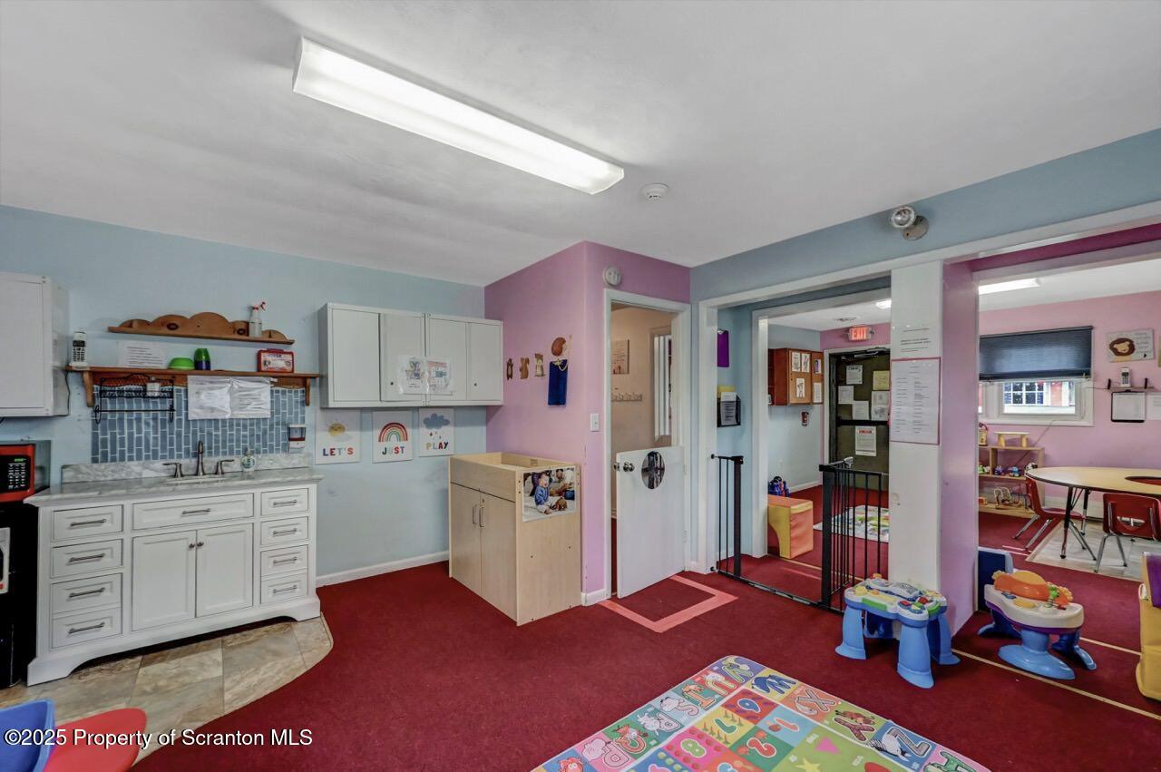 2118 Washburn Street Scranton, PA 18504 - Photo 24 of 72 a view of kitchen center with cabinets and wooden floor