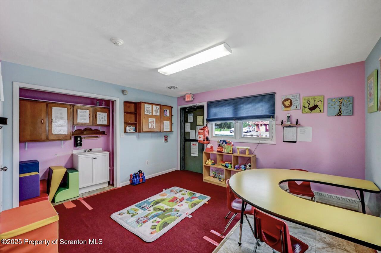 2118 Washburn Street Scranton, PA 18504 - Photo 25 of 72 a living room with furniture and a table