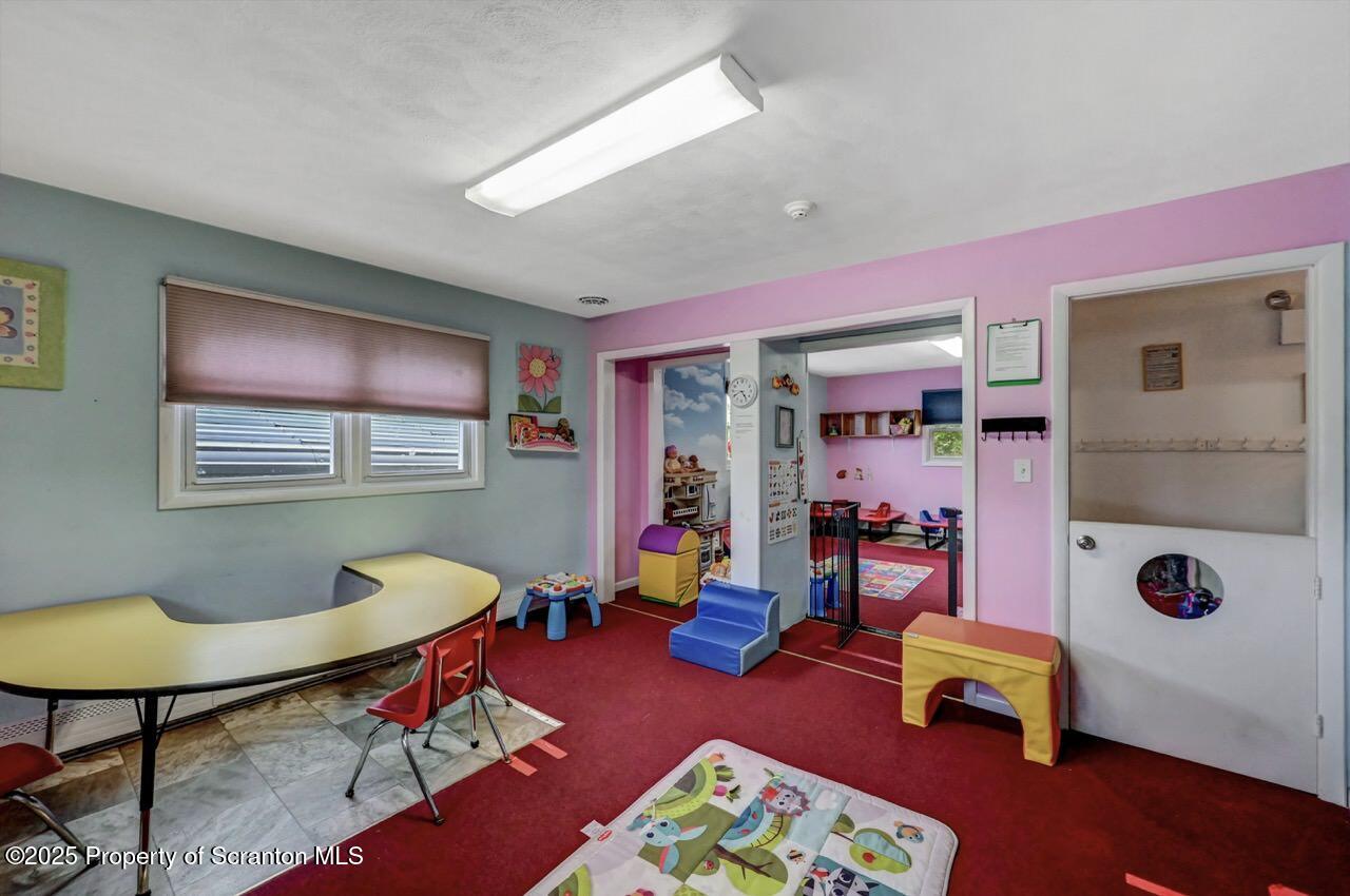 2118 Washburn Street Scranton, PA 18504 - Photo 27 of 72 a living room with furniture and a table