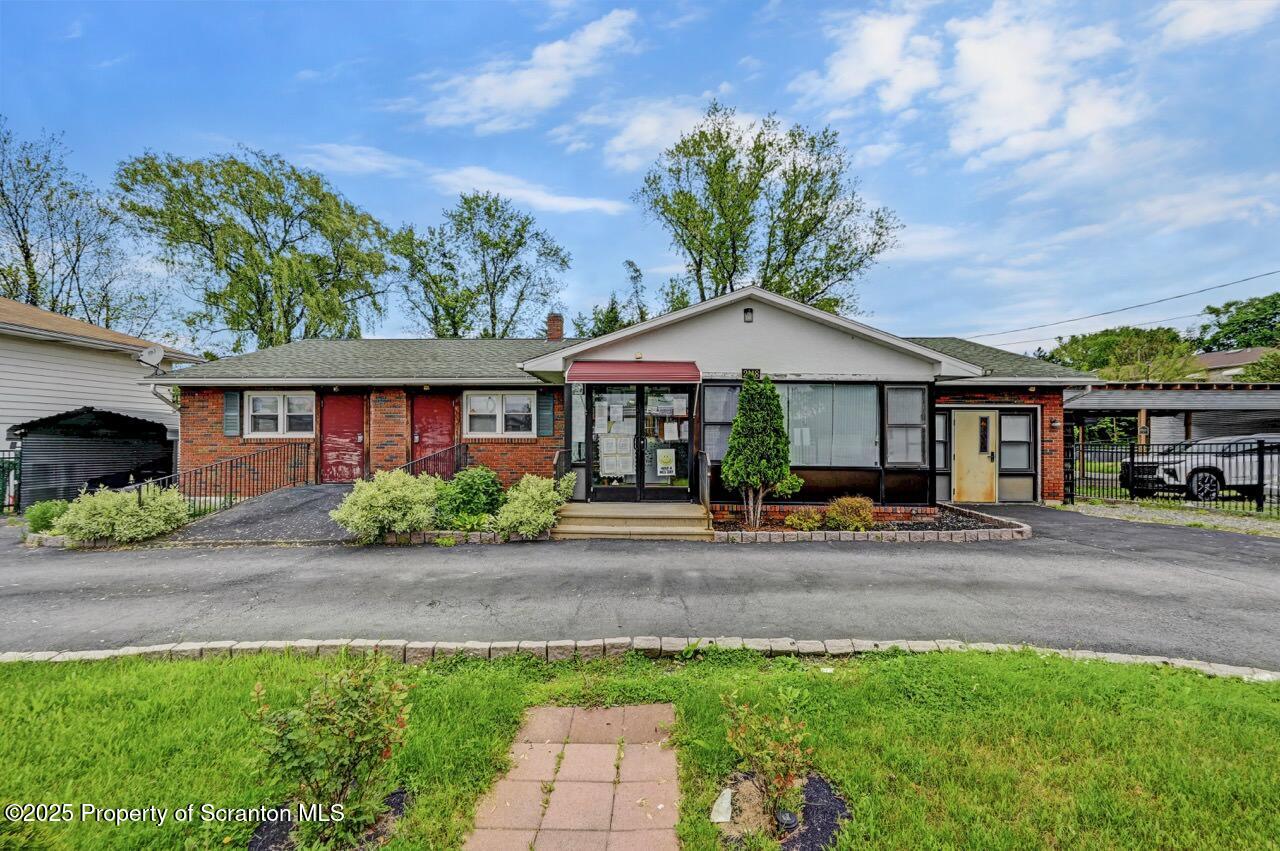 2118 Washburn Street Scranton, PA 18504 - Photo 3 of 72 a front view of a house with garden
