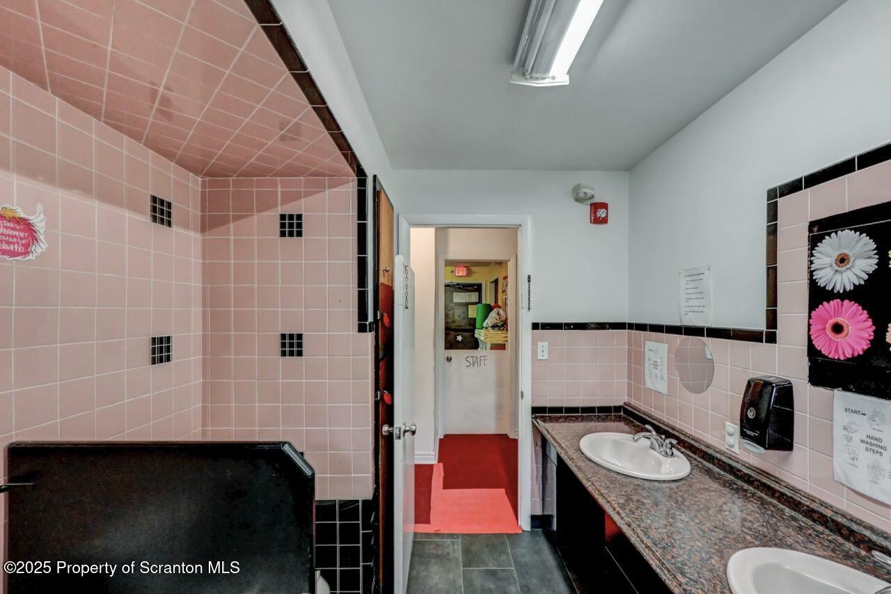 2118 Washburn Street Scranton, PA 18504 - Photo 31 of 72 a bathroom with a granite countertop sink a toilet and shower