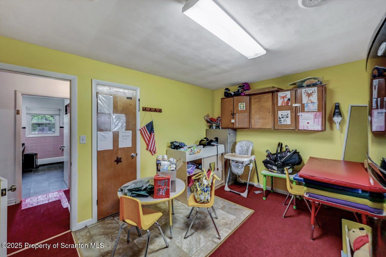 2118 Washburn Street Scranton, PA 18504 - Photo 35 of 72 a living room with furniture and a wooden floor