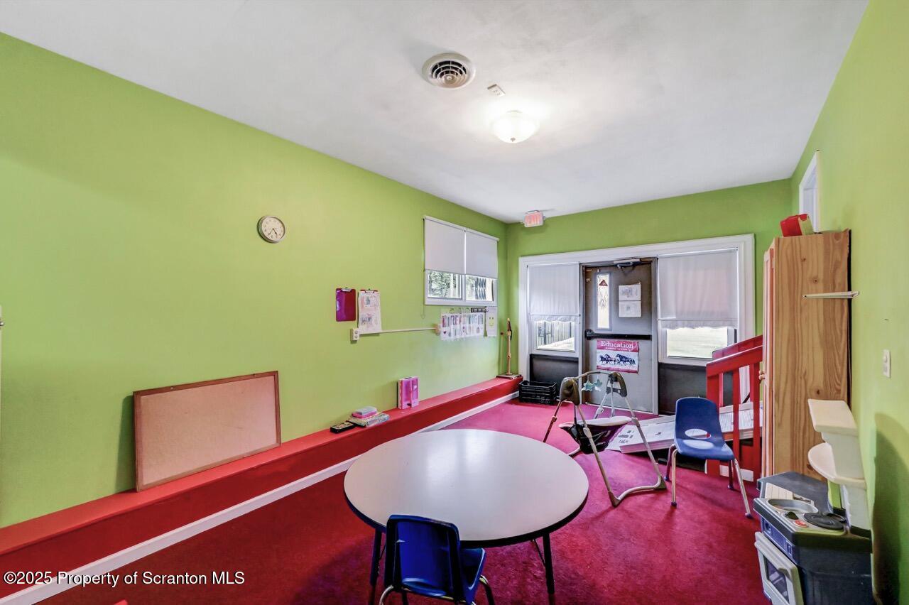 2118 Washburn Street Scranton, PA 18504 - Photo 37 of 72 a room with furniture and a mirror