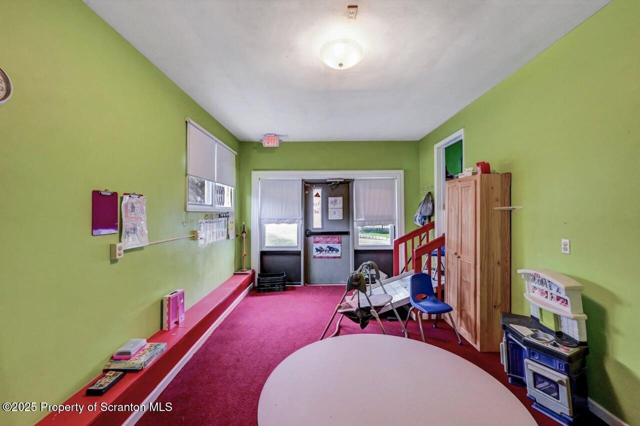 2118 Washburn Street Scranton, PA 18504 - Photo 38 of 72 a room with furniture and a flat screen tv