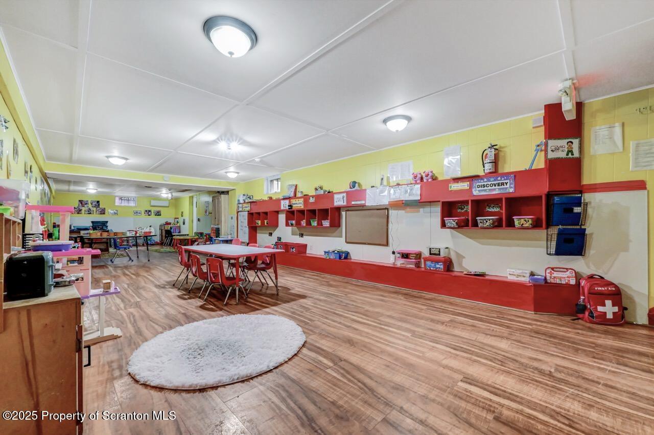 2118 Washburn Street Scranton, PA 18504 - Photo 44 of 72 a living room with lots of furniture and a flat screen tv