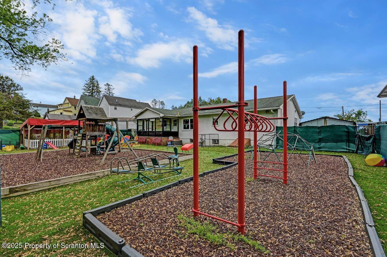 2118 Washburn Street Scranton, PA 18504 - Photo 62 of 72 a childrens park with lots of swings slides and swimming pool