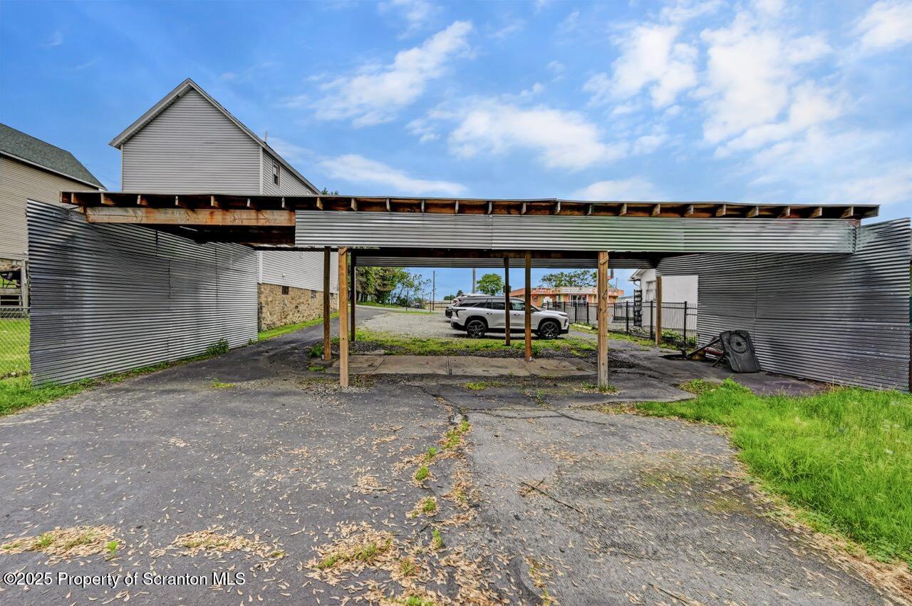 2118 Washburn Street Scranton, PA 18504 - Photo 66 of 72 a front view of a house with a yard and garage