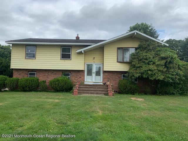 5 Elmore Road Freehold, NJ 07728 - Photo 1 of 4 a front view of a house with a garden