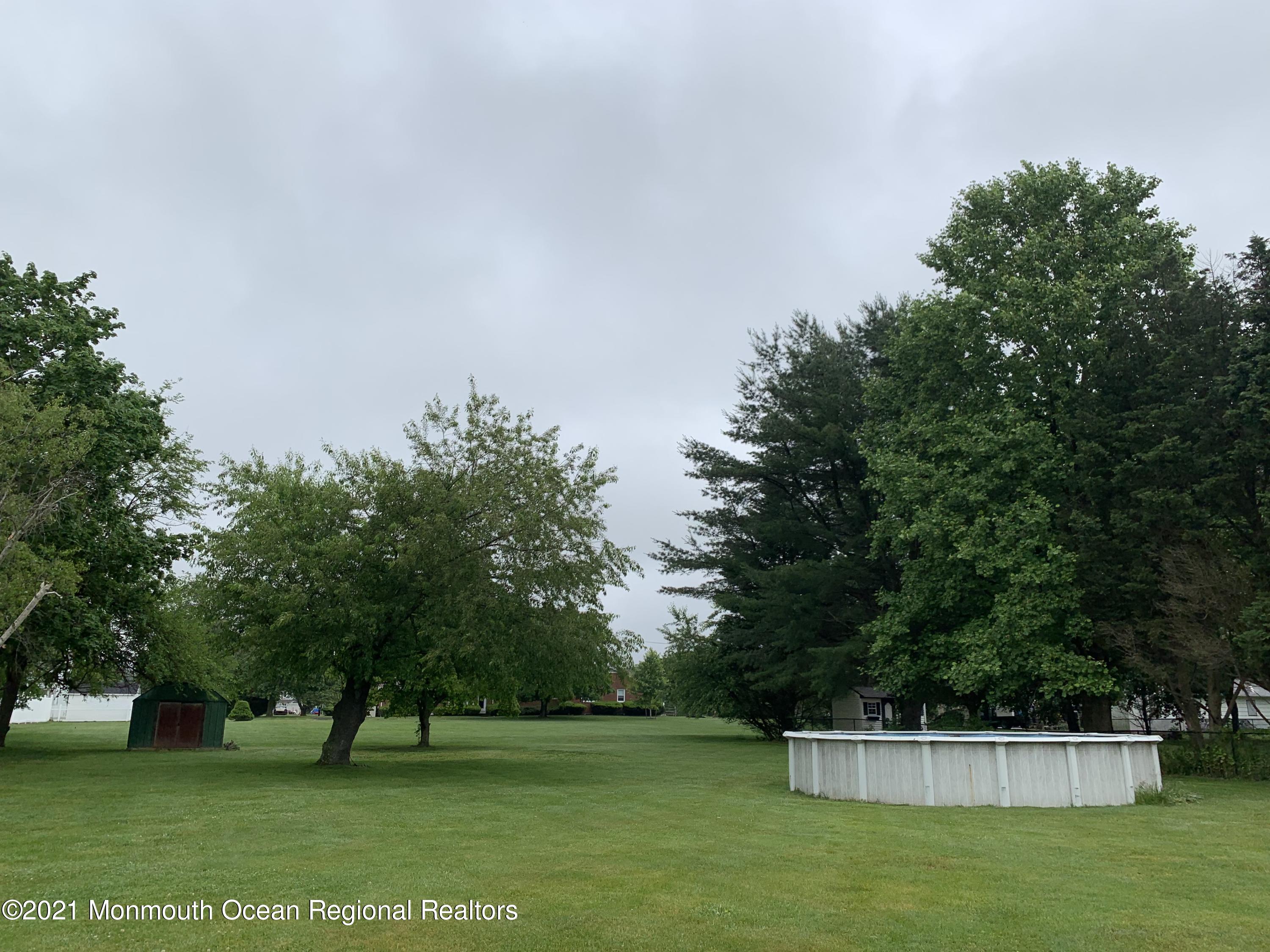 5 Elmore Road Freehold, NJ 07728 - Photo 2 of 4 a view of yard with grass and trees