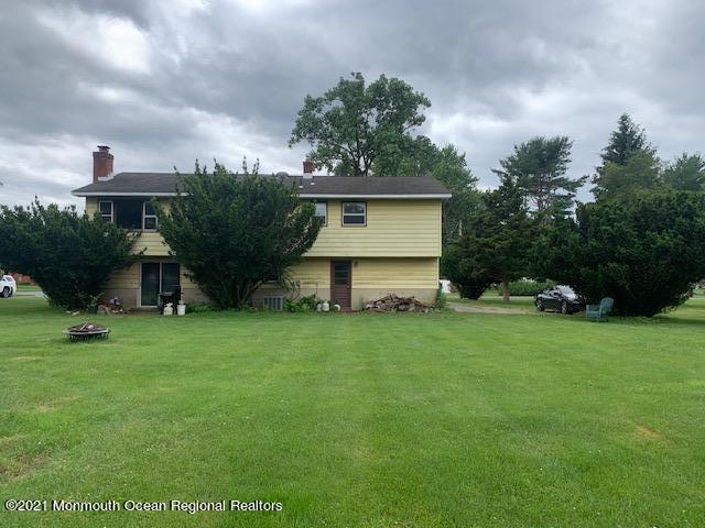 5 Elmore Road Freehold, NJ 07728 - Photo 3 of 4 a front view of a house with a garden