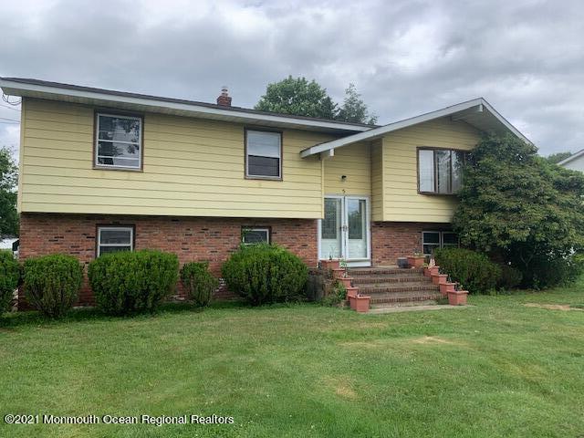 5 Elmore Road Freehold, NJ 07728 - Photo 4 of 4 a front view of a house with a yard