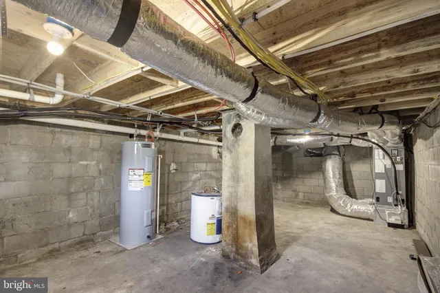 a view of empty room with wooden walls