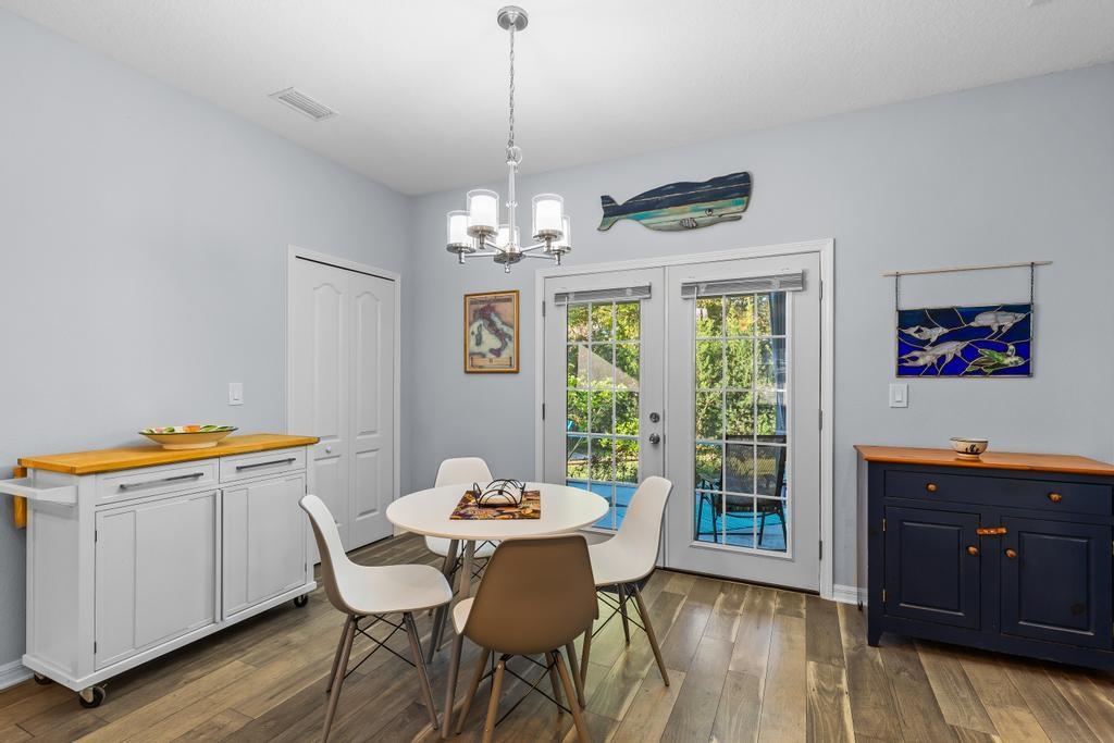 124 Dory Road St. Augustine, FL 32086 - Photo 13 of 39 a view of a dining room with furniture window and wooden floor