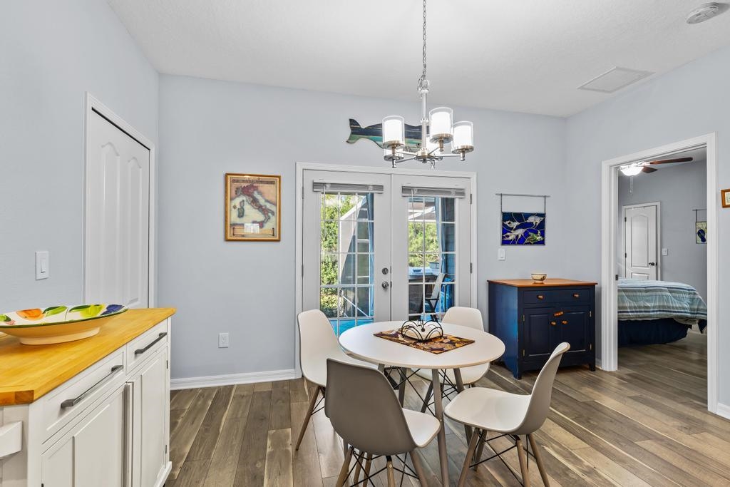 124 Dory Road St. Augustine, FL 32086 - Photo 14 of 39 a view of a dining room with furniture window and wooden floor