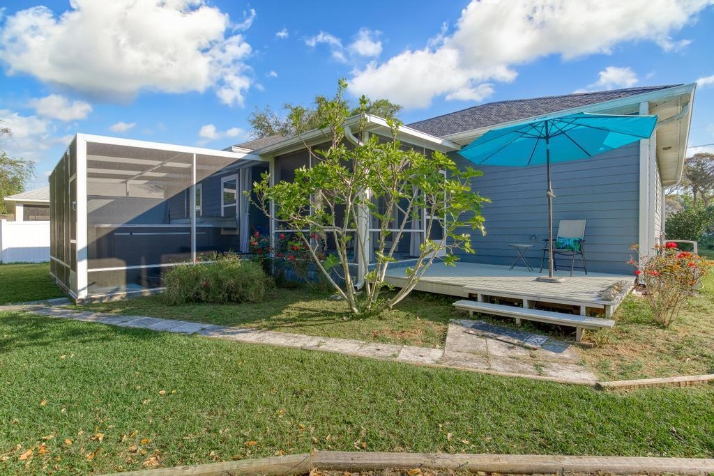 124 Dory Road St. Augustine, FL 32086 - Photo 32 of 39 a view of a backyard with a garden and entertaining space