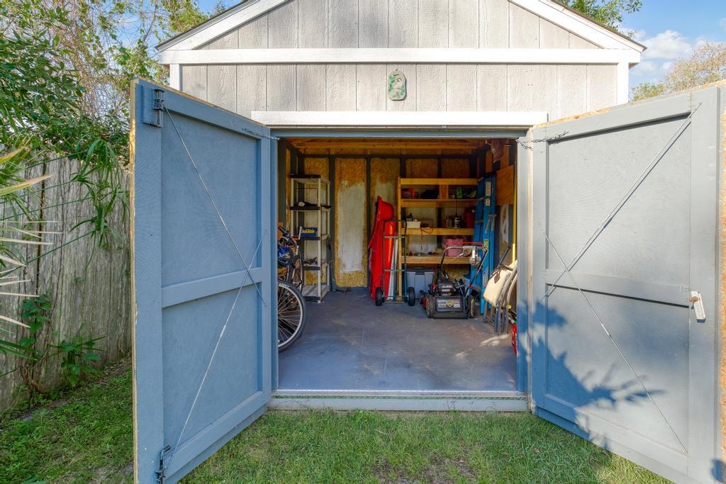 124 Dory Road St. Augustine, FL 32086 - Photo 36 of 39 a view of a house with a porch and furniture