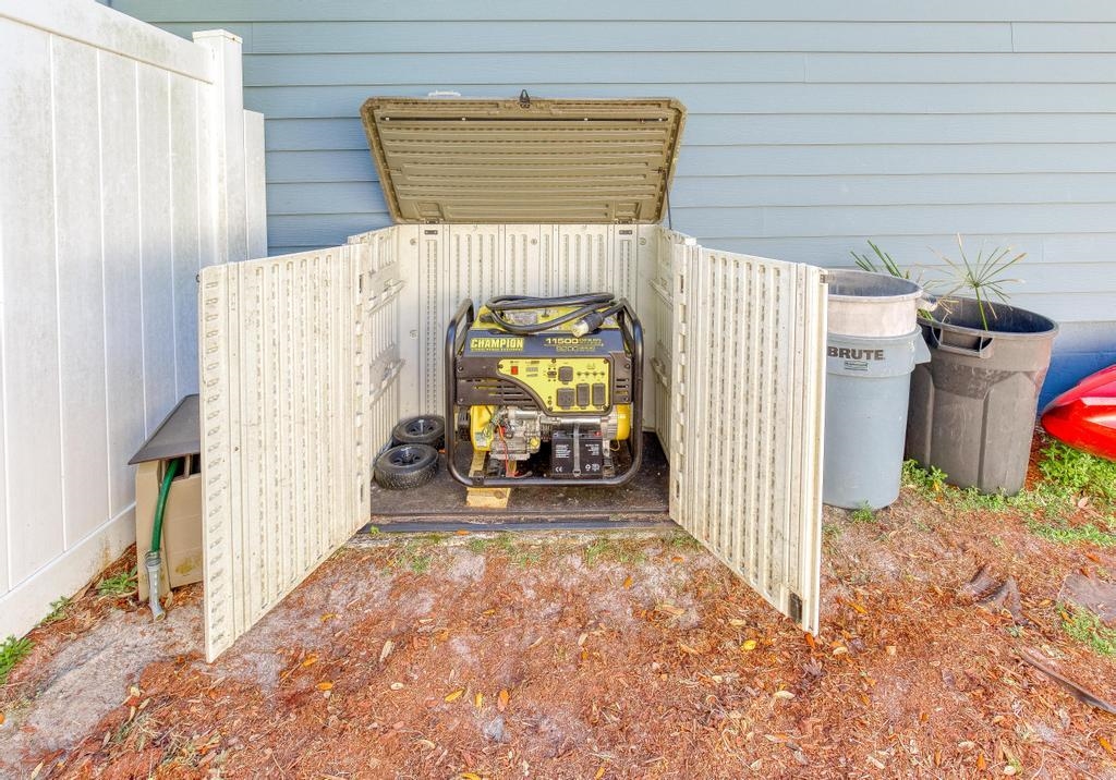 124 Dory Road St. Augustine, FL 32086 - Photo 38 of 39 a view of a porch with furniture and floor to ceiling window