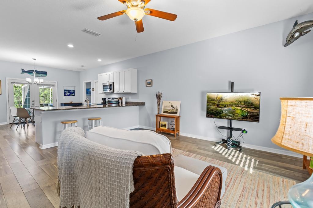 124 Dory Road St. Augustine, FL 32086 - Photo 5 of 39 a living room with furniture and a flat screen tv