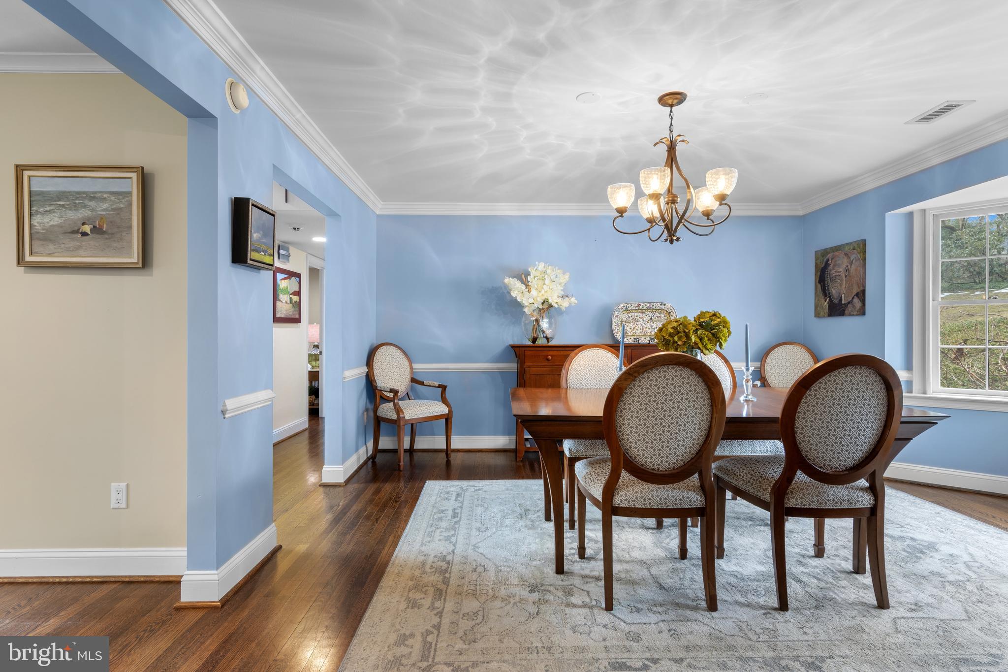 152 Hunters Lane Devon, PA 19333 - Photo 23 of 57 a view of a dining room with furniture a chandelier and wooden floor