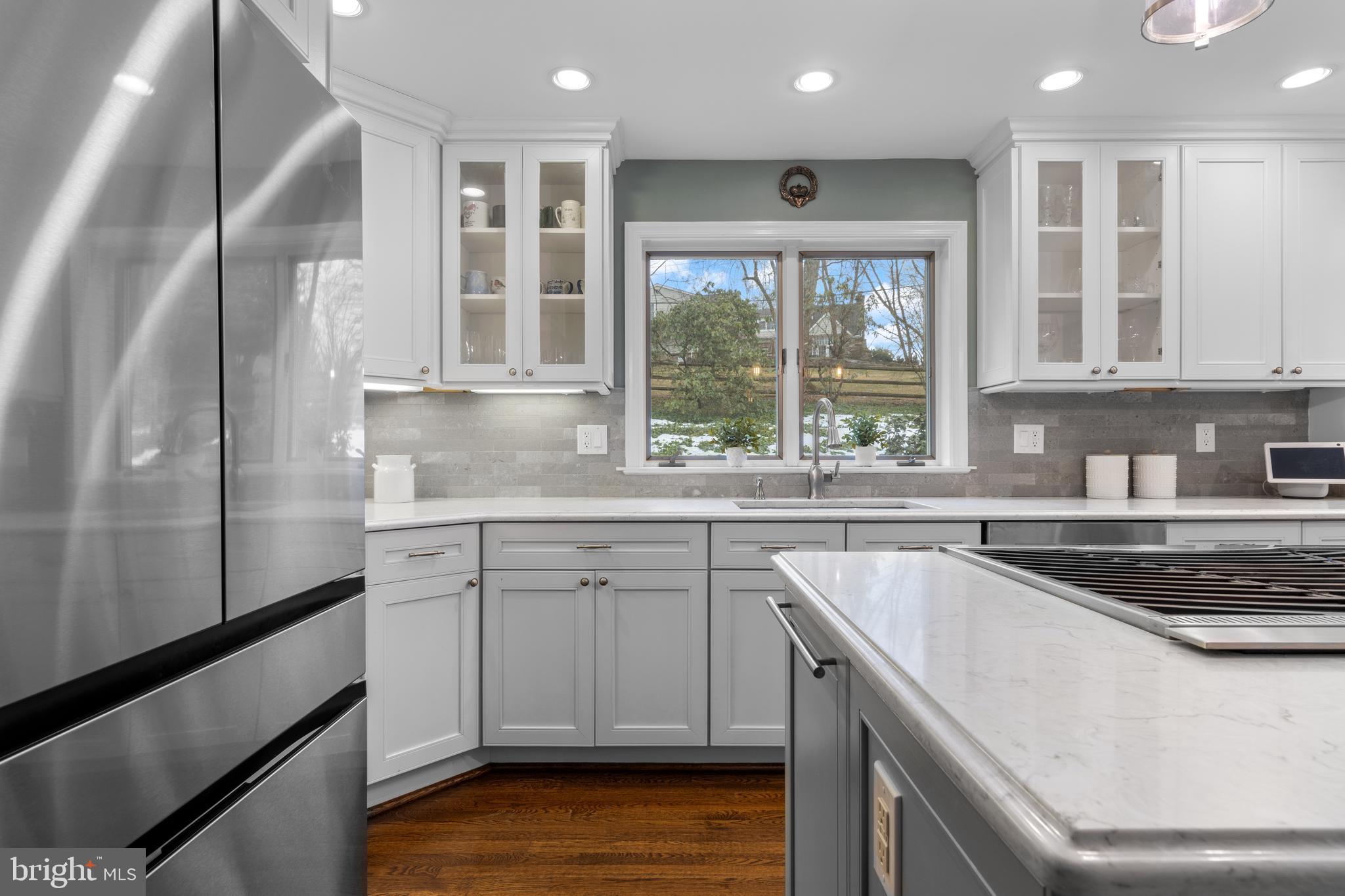 152 Hunters Lane Devon, PA 19333 - Photo 26 of 57 a kitchen that has a sink and a stove in it
