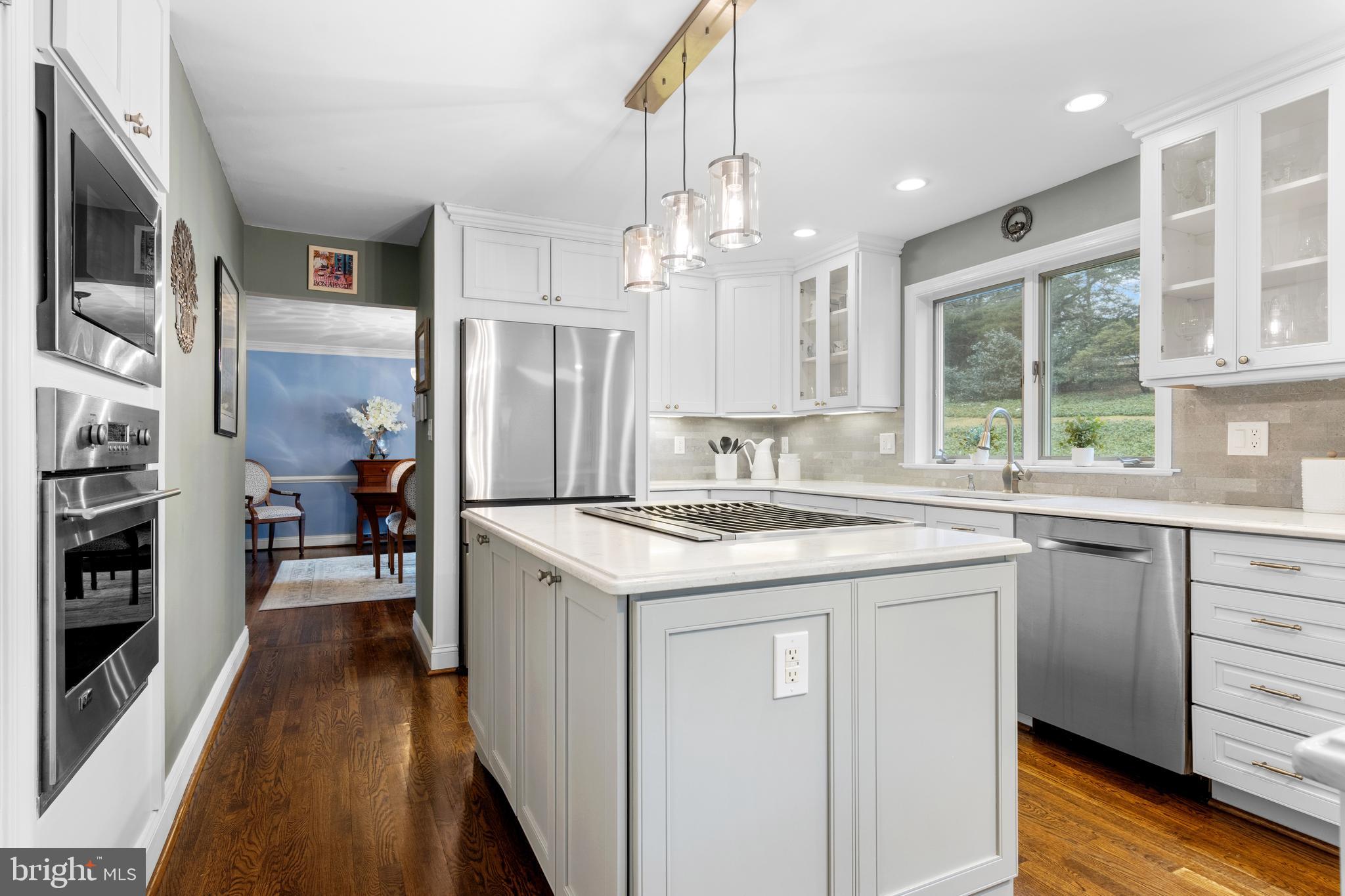 152 Hunters Lane Devon, PA 19333 - Photo 27 of 57 a kitchen with a stove a refrigerator and a sink