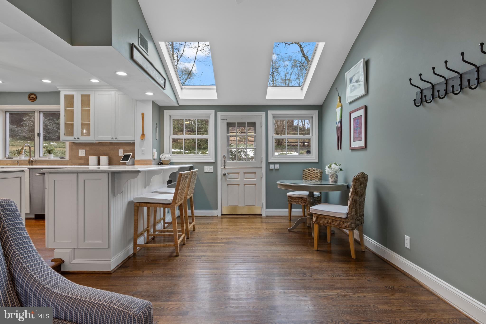 152 Hunters Lane Devon, PA 19333 - Photo 31 of 57 a living room with furniture and a dining table with wooden floor