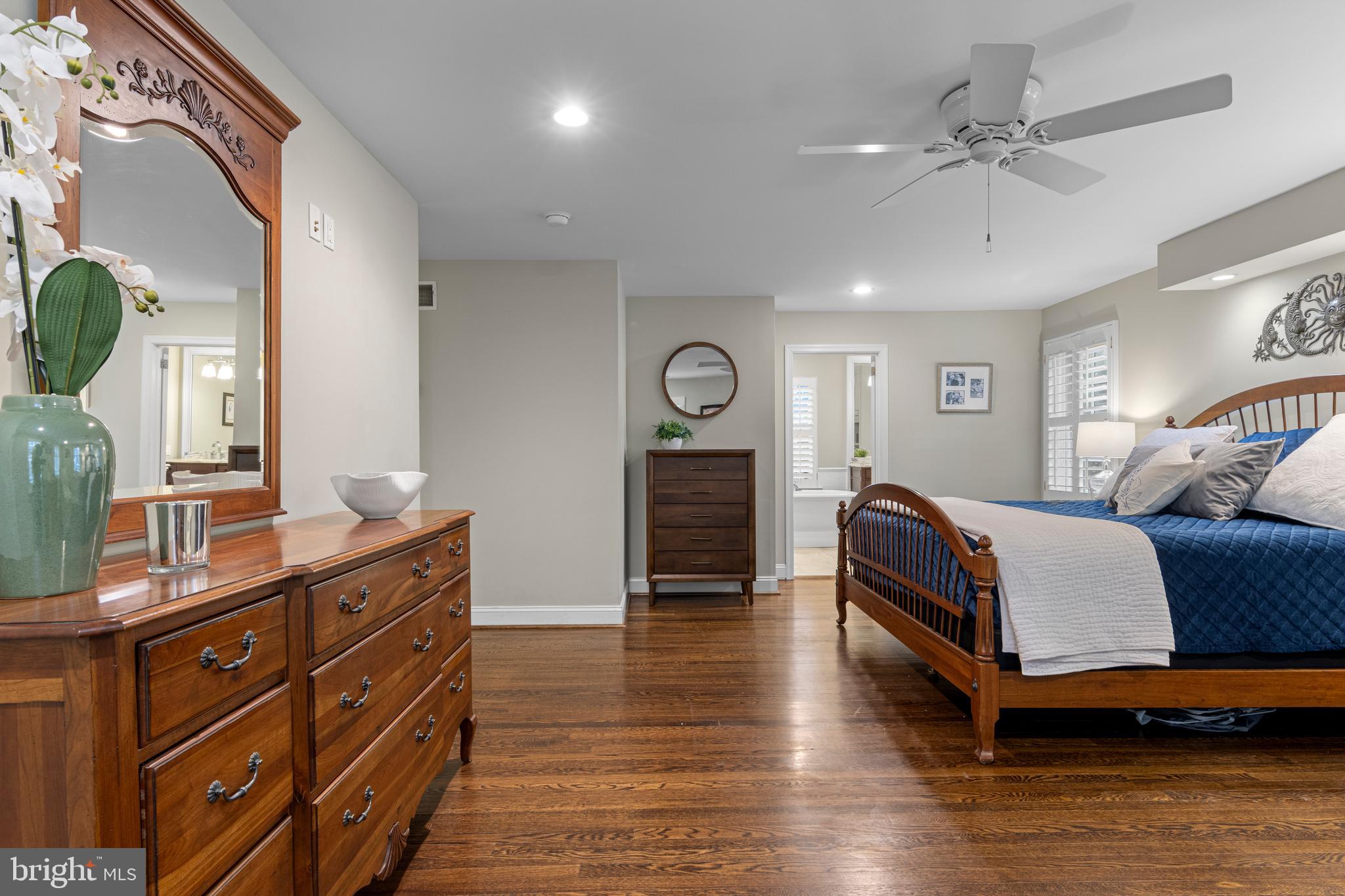 152 Hunters Lane Devon, PA 19333 - Photo 34 of 57 a spacious bedroom with a bed and wooden floor