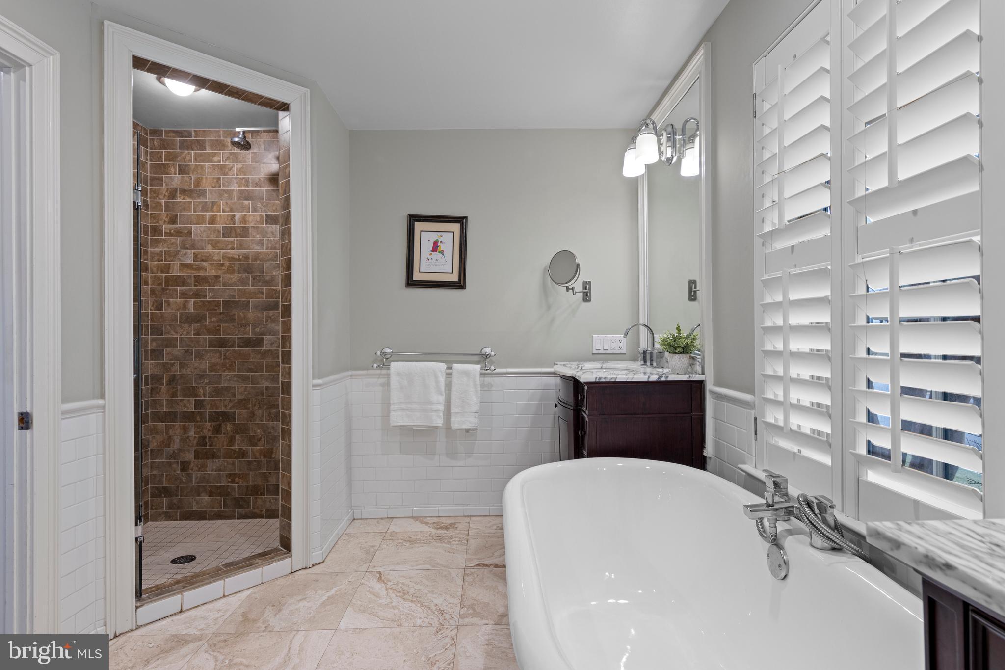 152 Hunters Lane Devon, PA 19333 - Photo 37 of 57 a bathroom with a granite countertop sink a toilet and shower