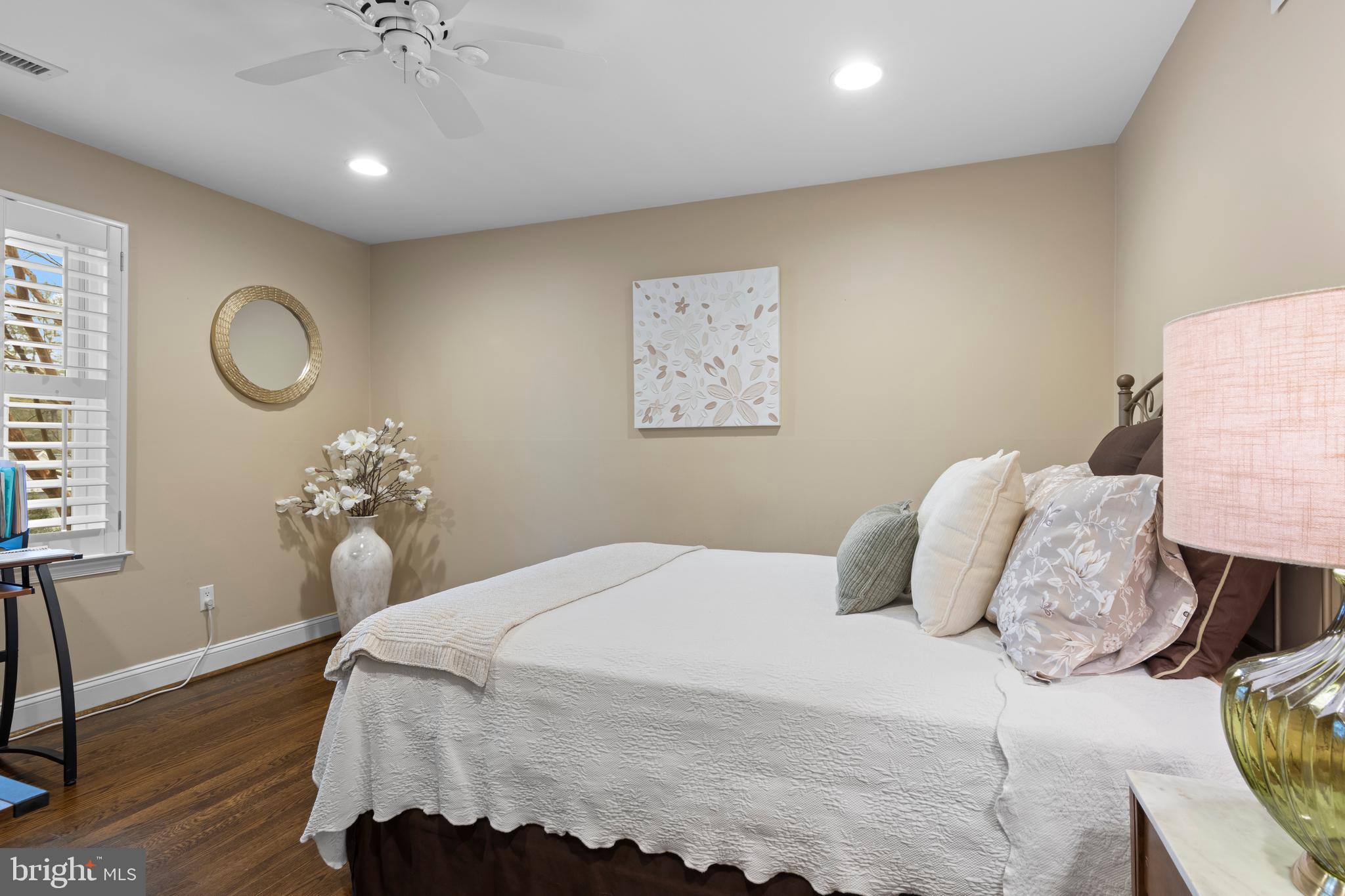 152 Hunters Lane Devon, PA 19333 - Photo 39 of 57 a bedroom with a bed and wooden floor