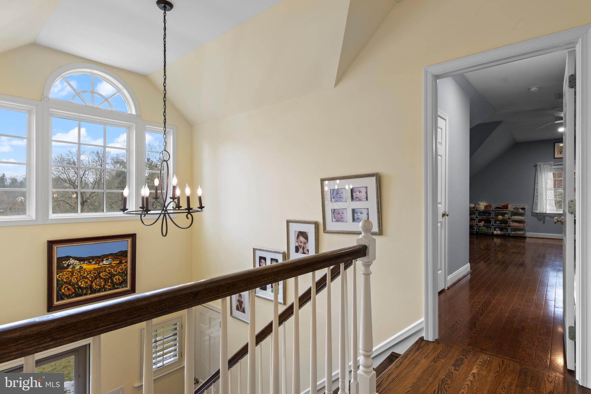 152 Hunters Lane Devon, PA 19333 - Photo 43 of 57 a view of a hallway with wooden floor and stairs