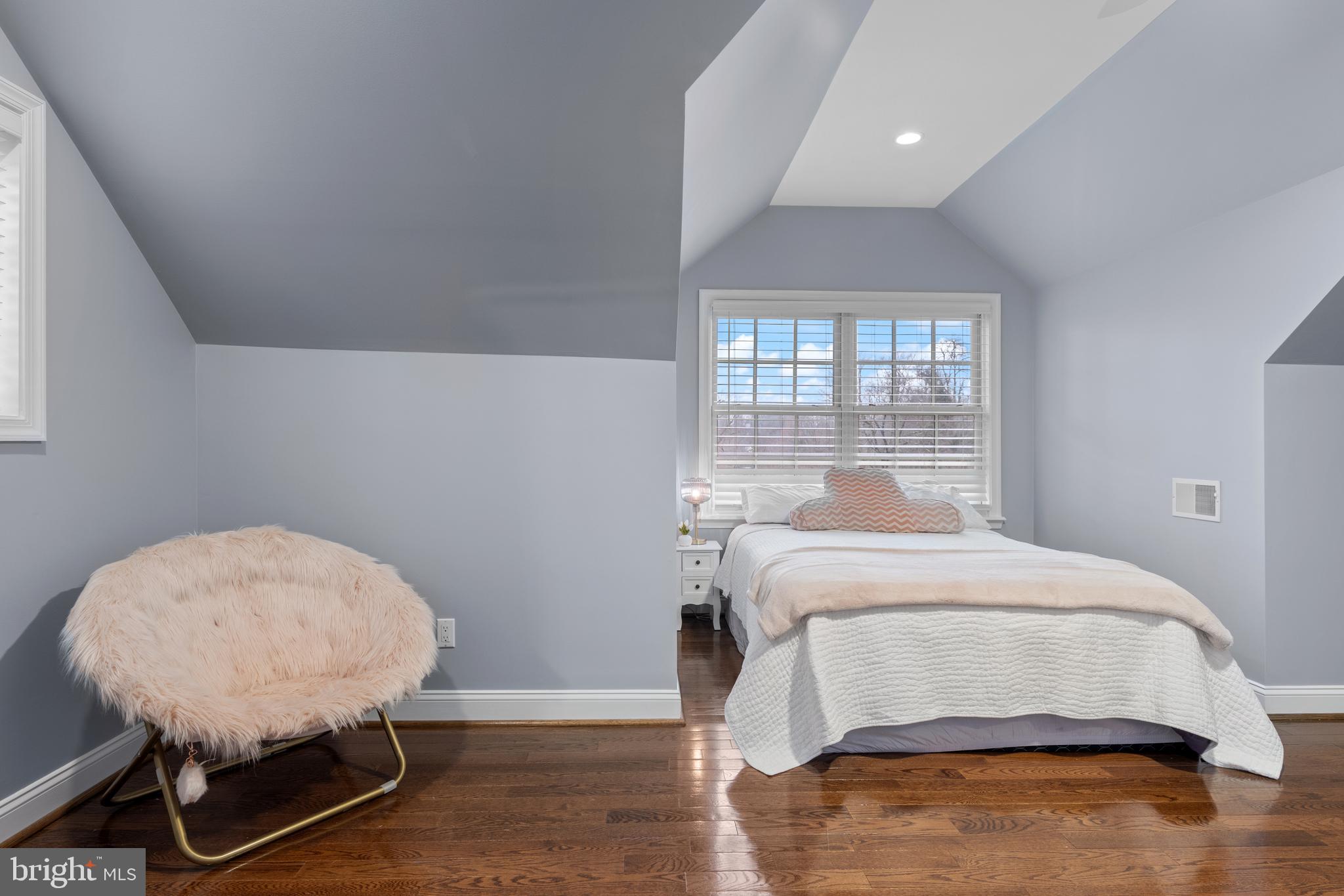 152 Hunters Lane Devon, PA 19333 - Photo 46 of 57 a bedroom with a bed a chair and a window