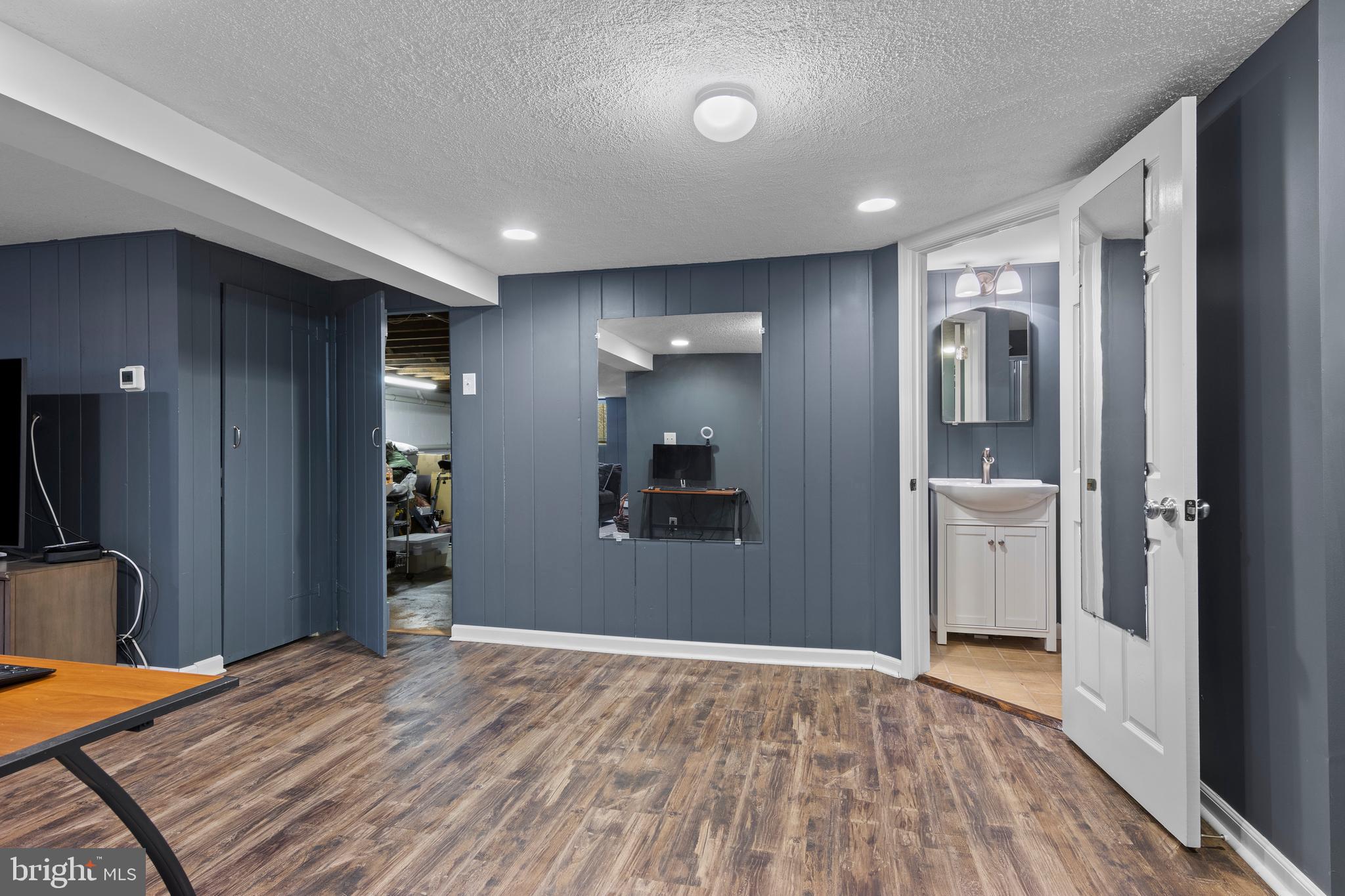152 Hunters Lane Devon, PA 19333 - Photo 56 of 57 a view of a hallway with wooden floor and cabinet