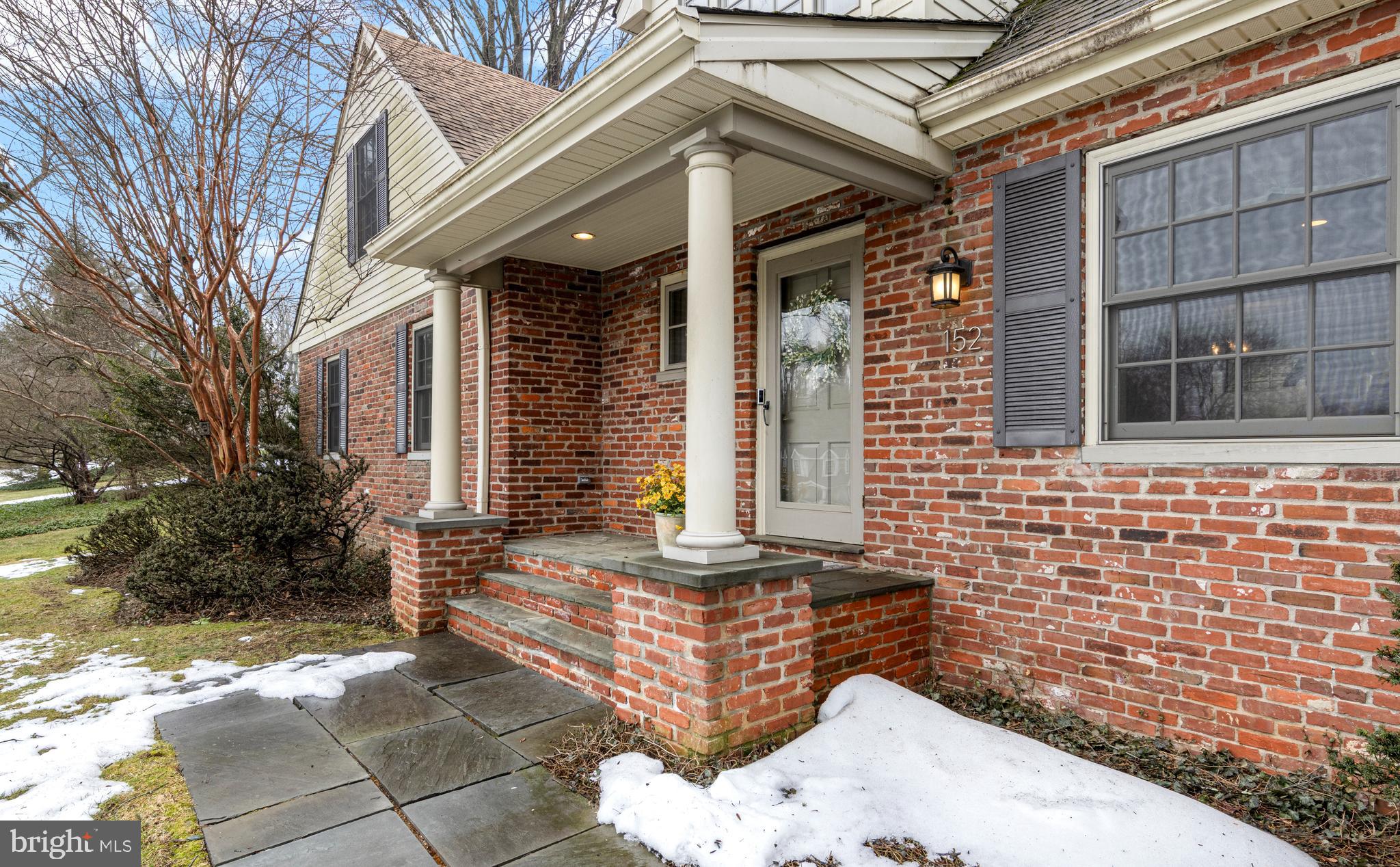 152 Hunters Lane Devon, PA 19333 - Photo 6 of 57 a front view of a house with a garden