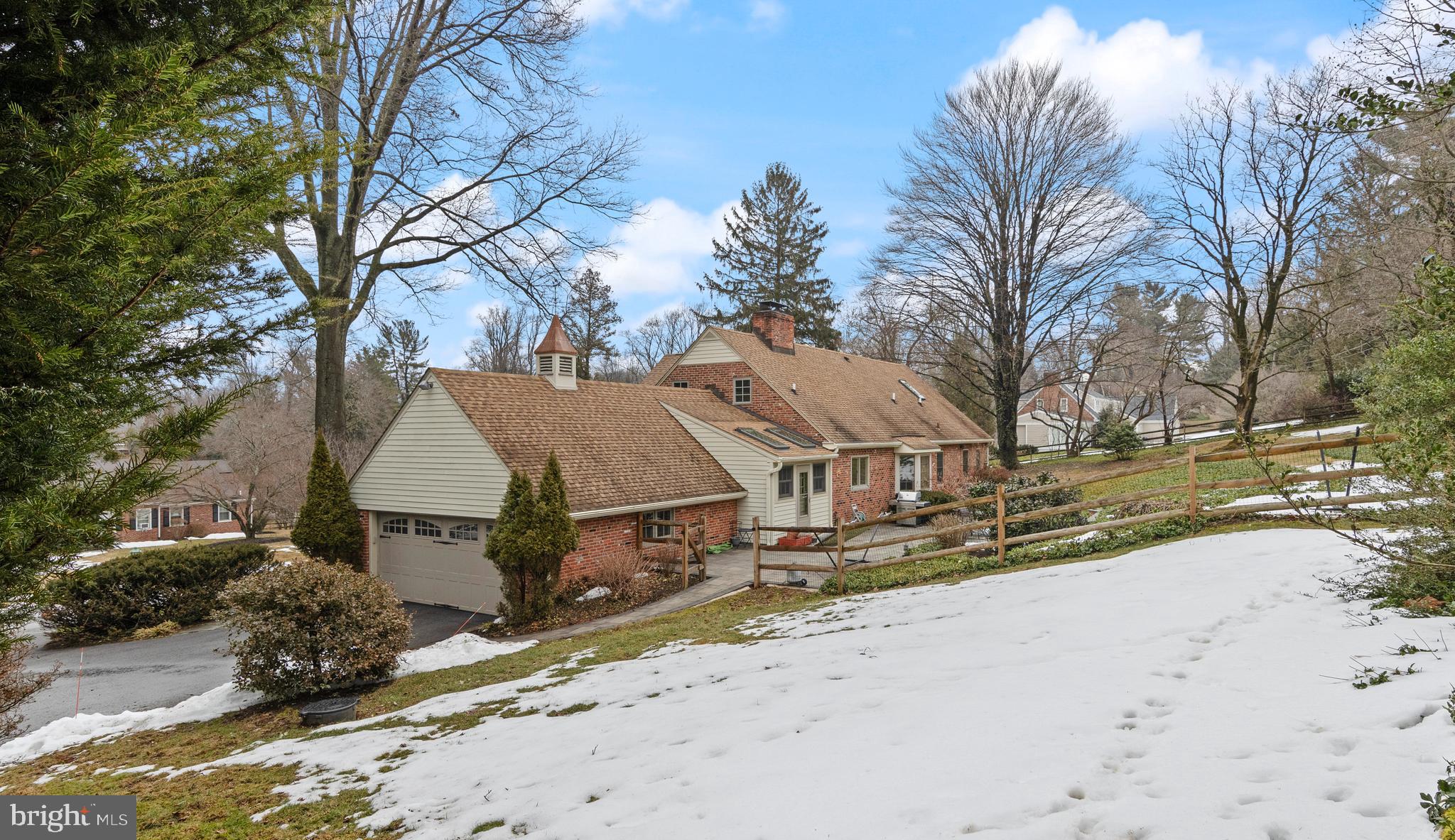 152 Hunters Lane Devon, PA 19333 - Photo 10 of 57 a view of a house with snow on the road