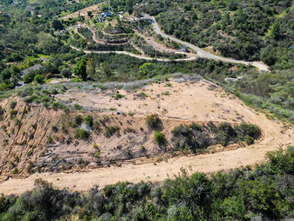9932 Gomez Creek Road Fallbrook, CA 92028 - Photo 13 of 30 a view of a road with a yard